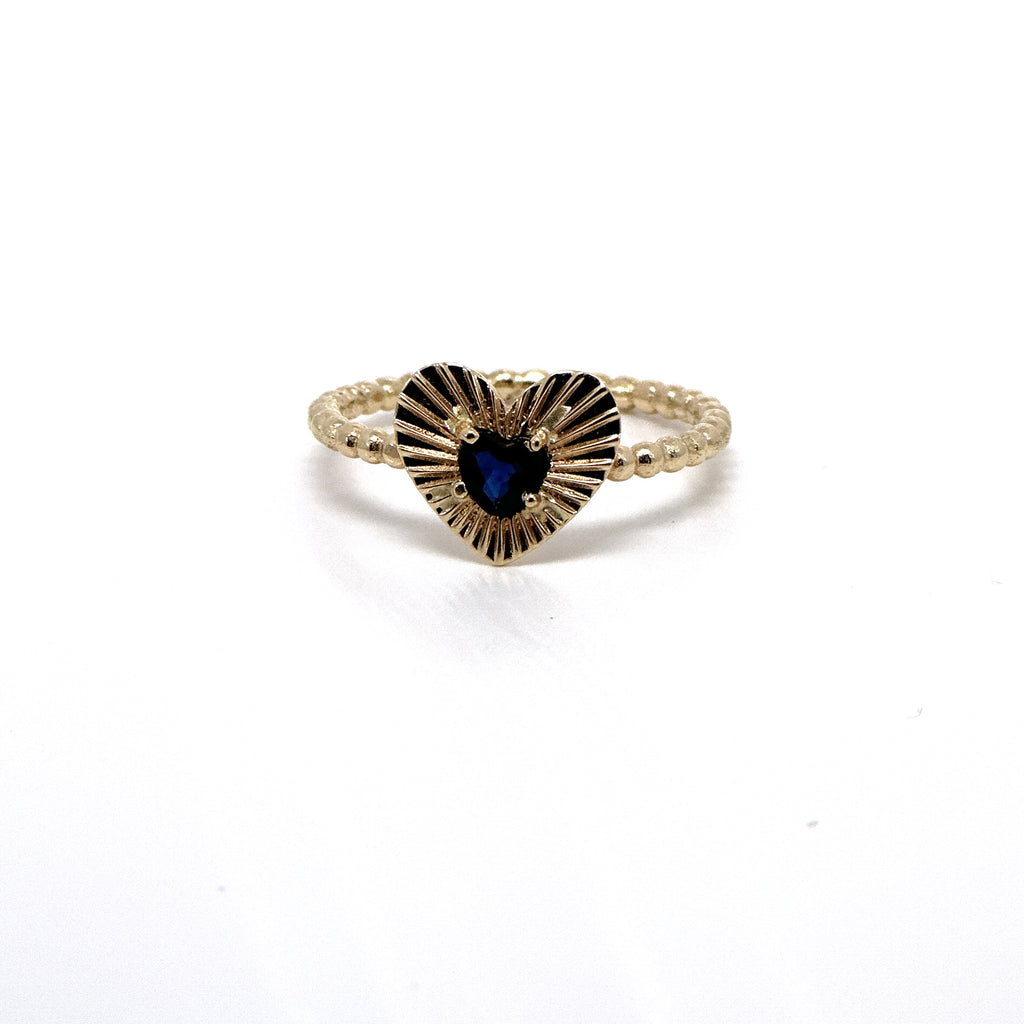 Anillo diamantado y zafiro azul